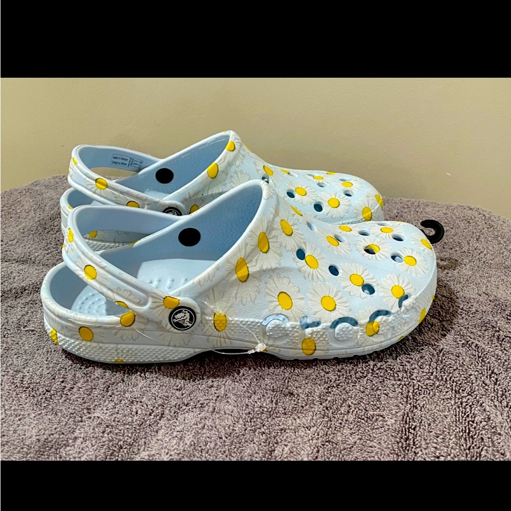 Daisy Crocs, light blue color 
size W-10 M-8